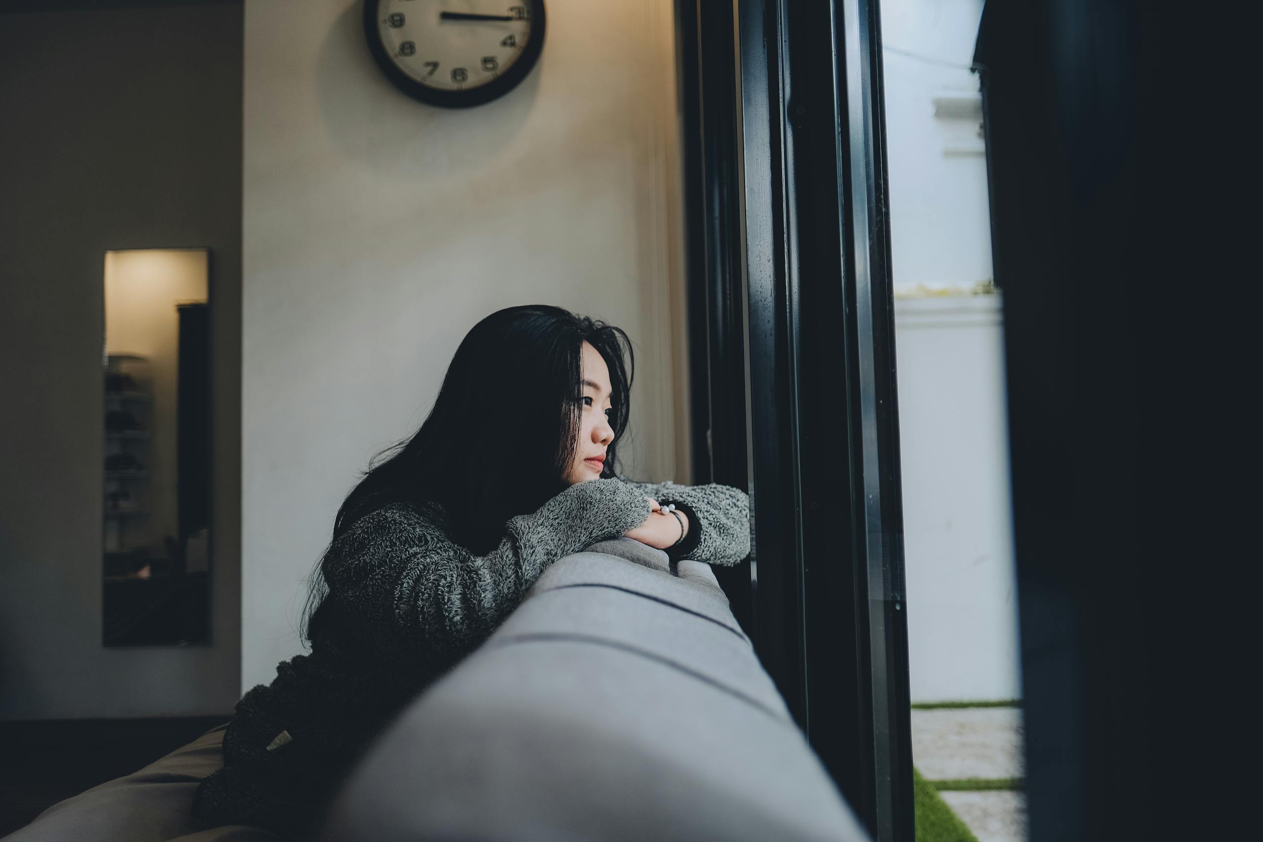 A Woman Looking Outside the Window