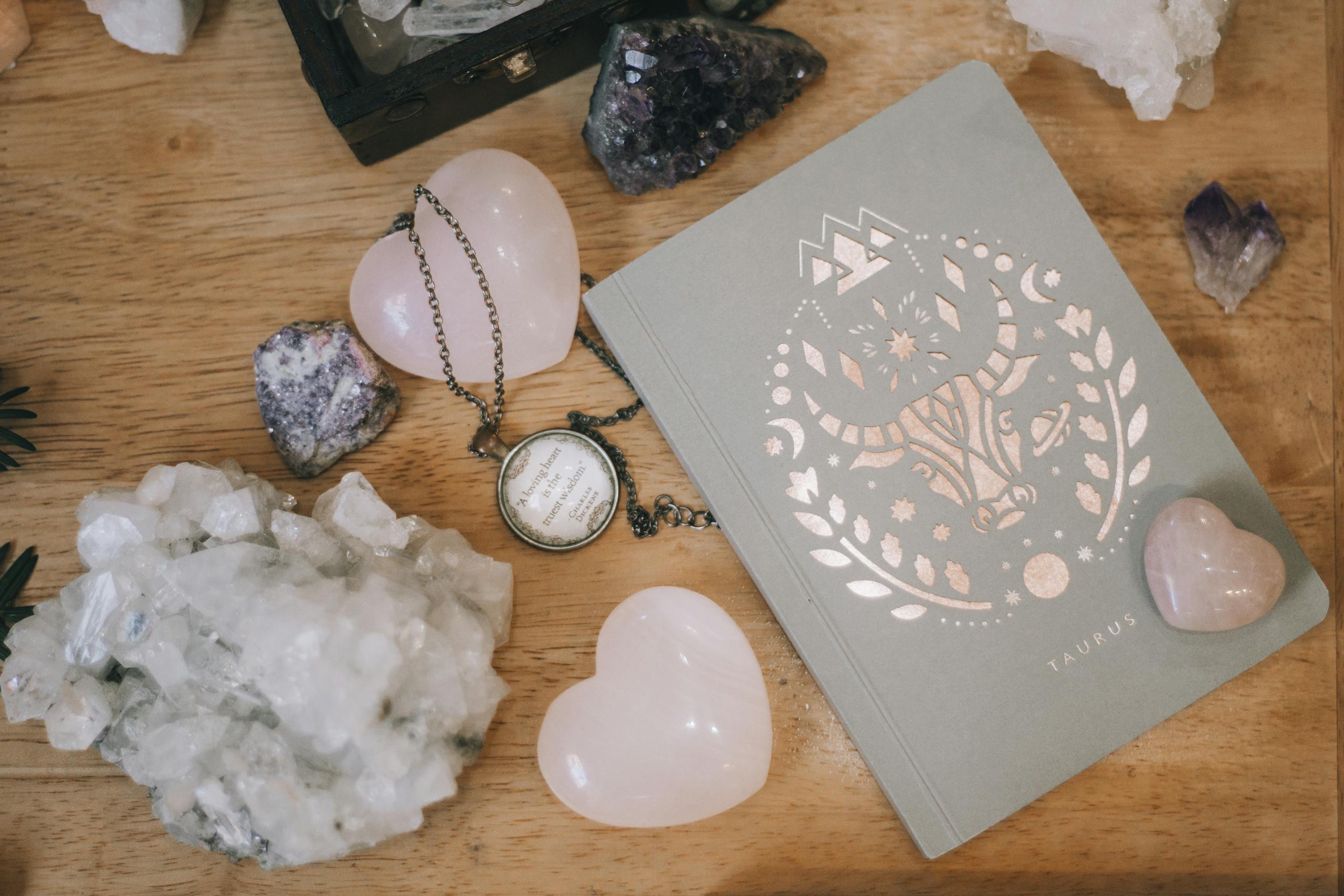 Pink Crystals Near A Notebook